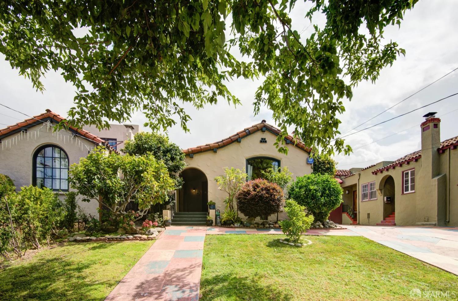 3231 Fernside Boulevard Alameda, CA 94501 - Photo 1 of 38 a front view of a house with garden and trees