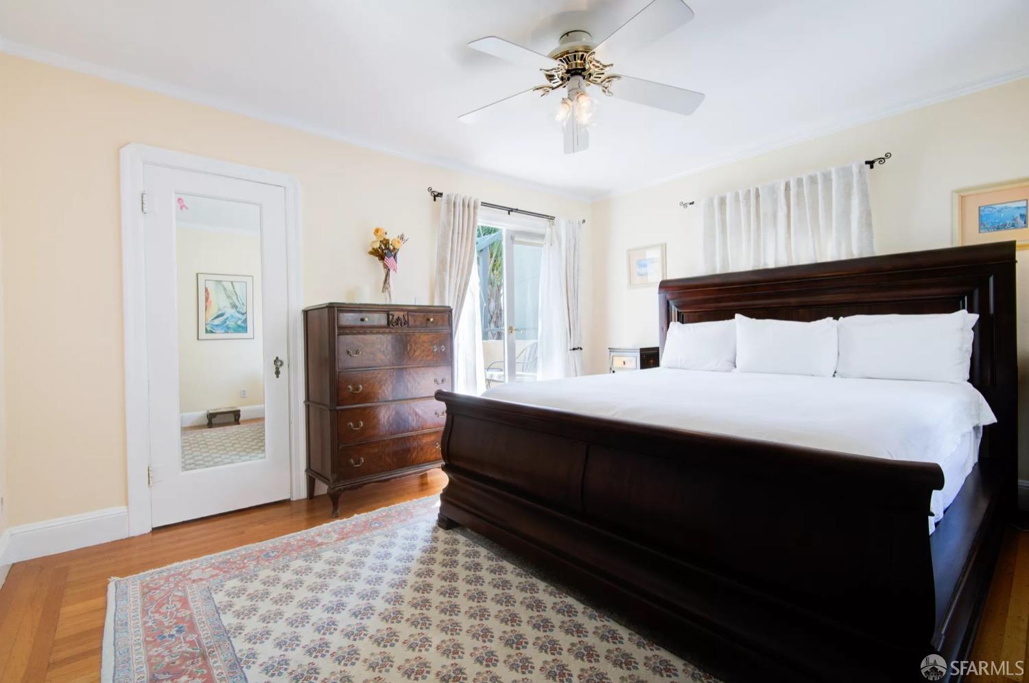 3231 Fernside Boulevard Alameda, CA 94501 - Photo 16 of 38 a bedroom with a bed and a dresser