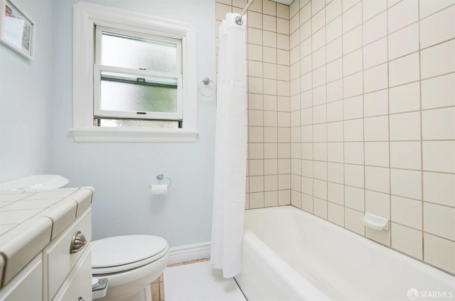 3231 Fernside Boulevard Alameda, CA 94501 - Photo 19 of 38 a white bath tub sitting next to a white toilet