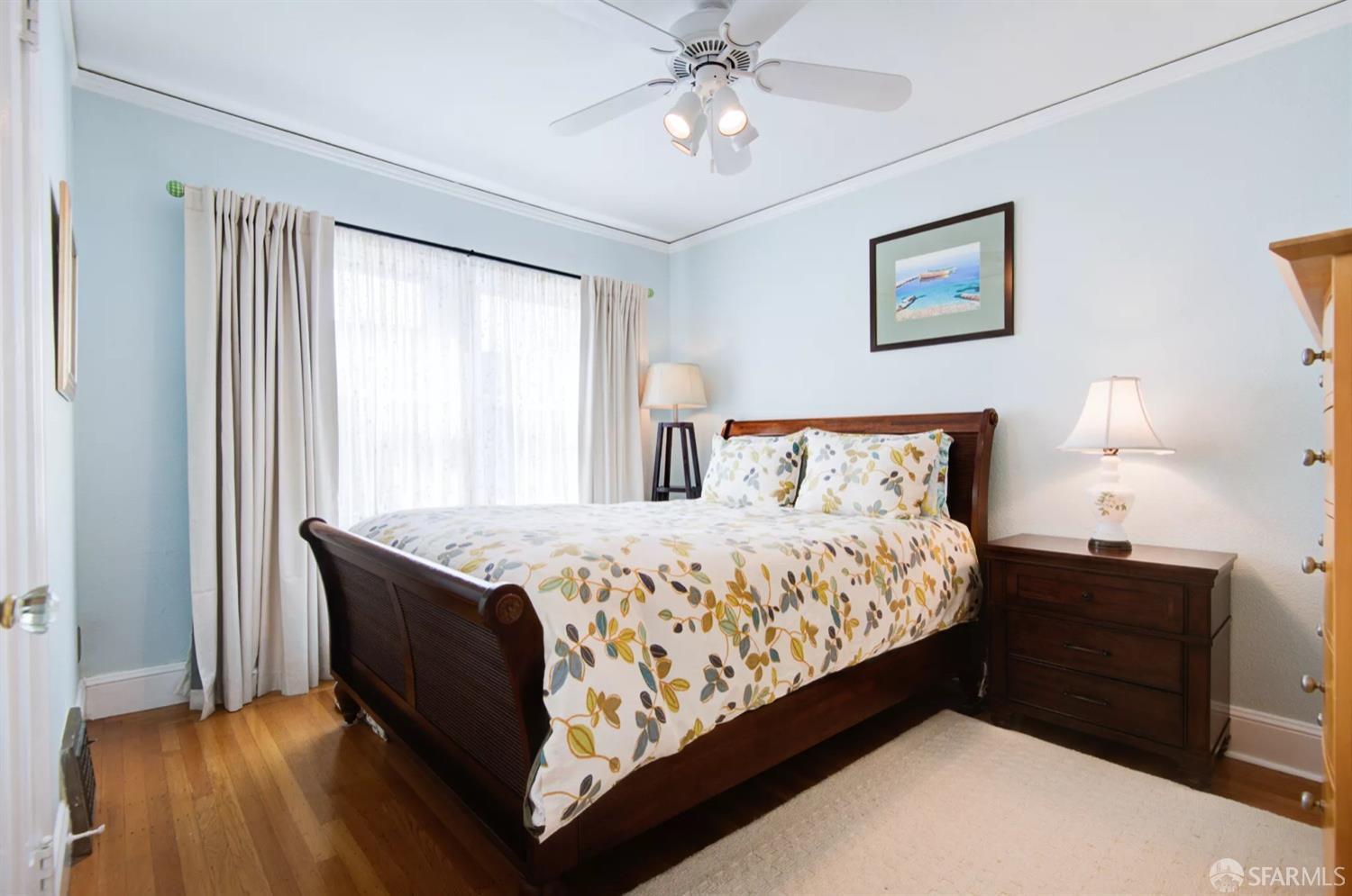 3231 Fernside Boulevard Alameda, CA 94501 - Photo 20 of 38 a bedroom with a bed and wooden floor