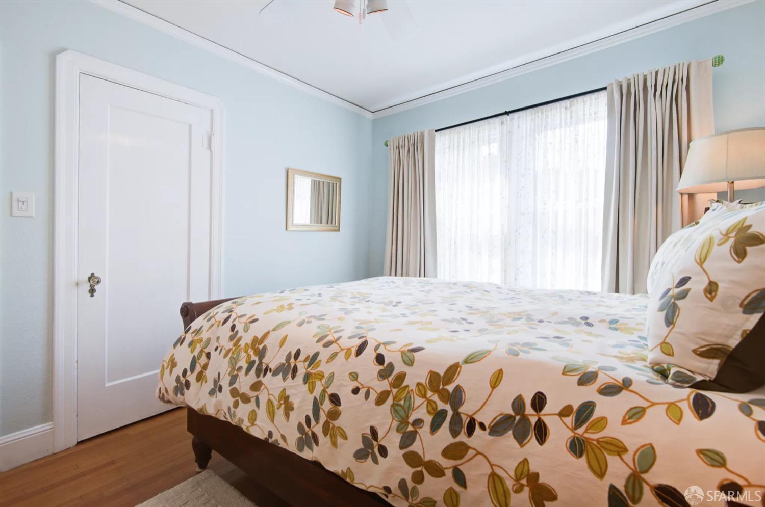 3231 Fernside Boulevard Alameda, CA 94501 - Photo 21 of 38 a bedroom with a bed and a window