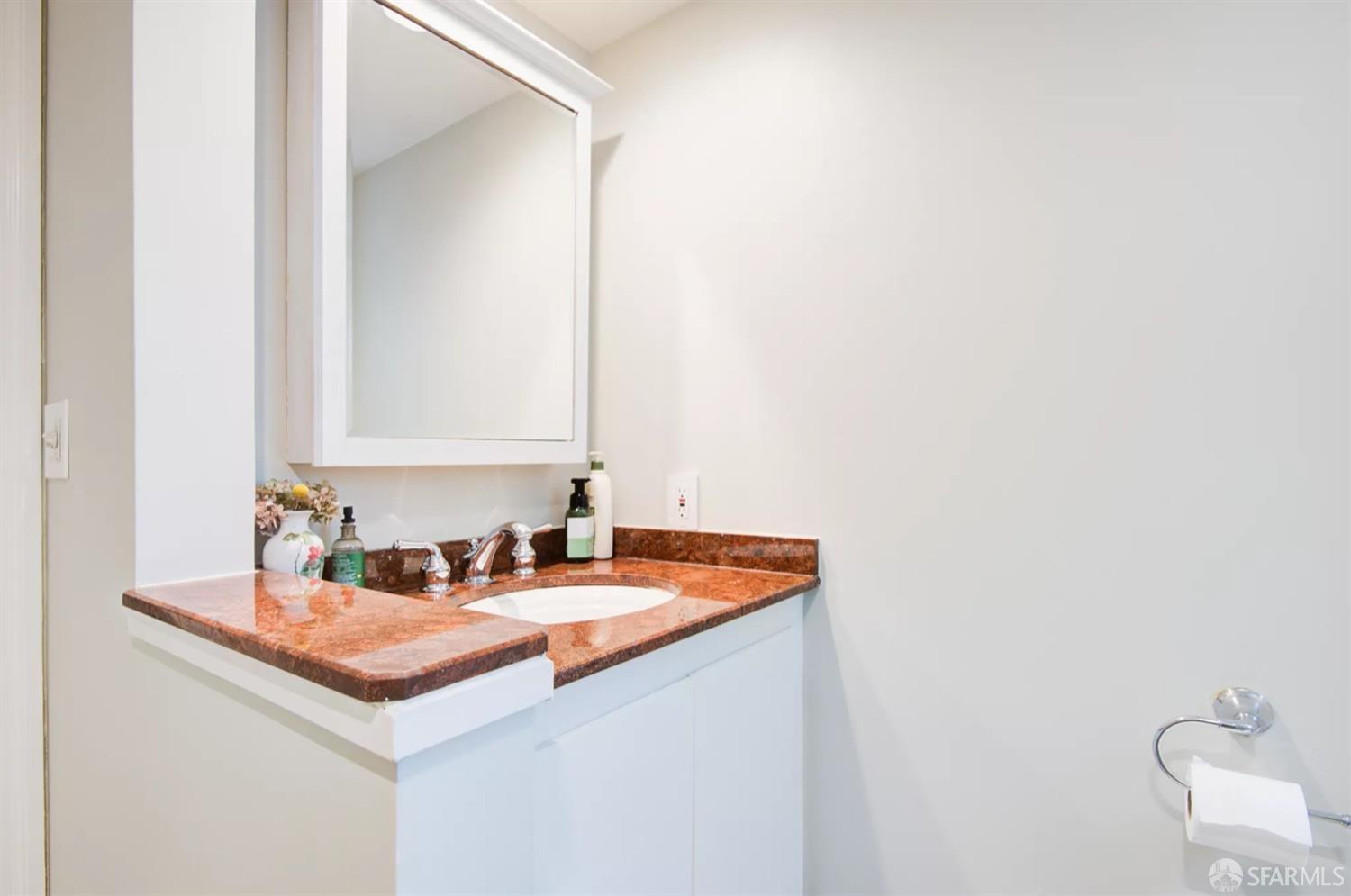 3231 Fernside Boulevard Alameda, CA 94501 - Photo 22 of 38 a bathroom with a sink and a mirror