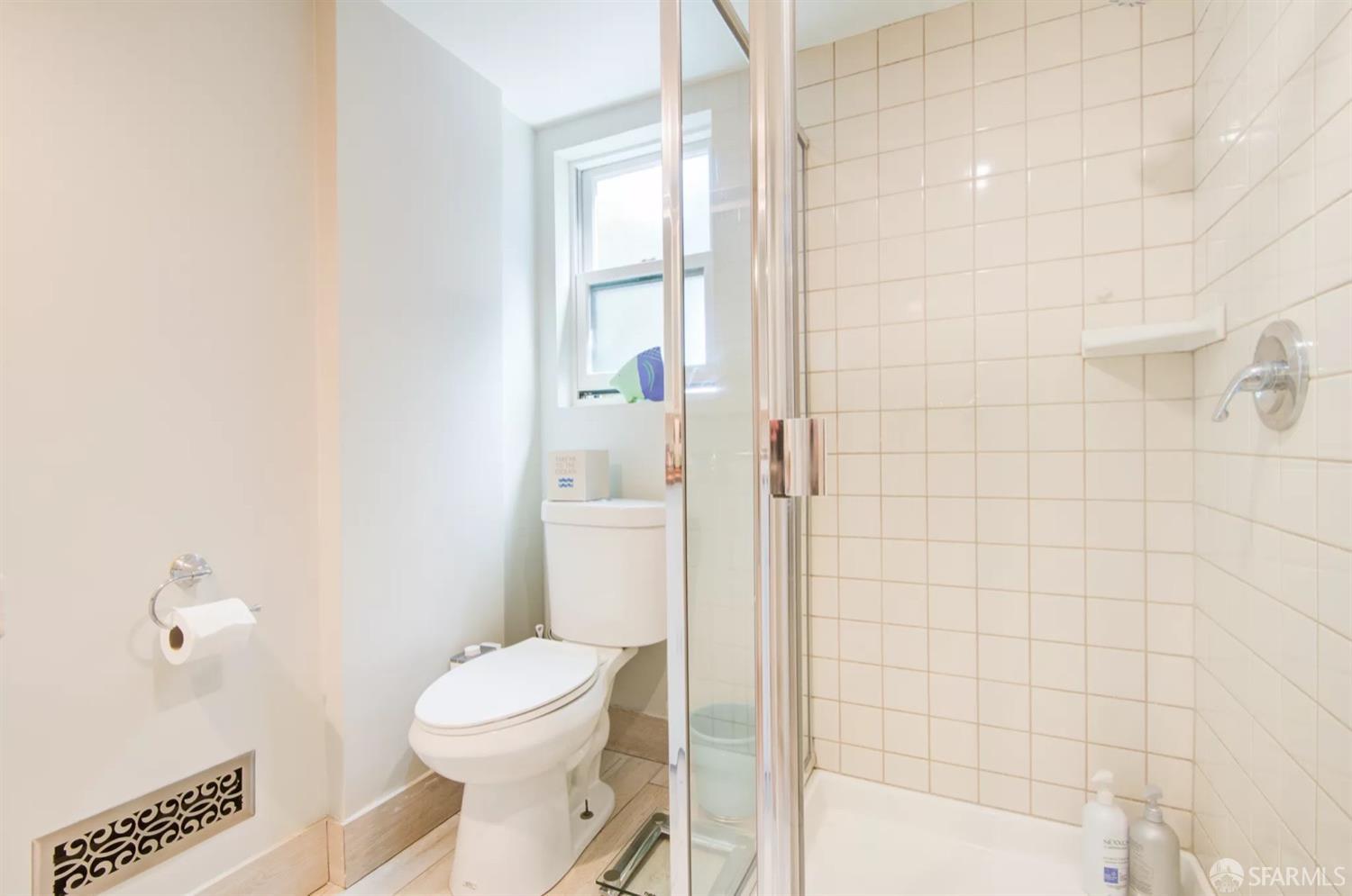 3231 Fernside Boulevard Alameda, CA 94501 - Photo 23 of 38 a white toilet sitting next to a bathroom sink