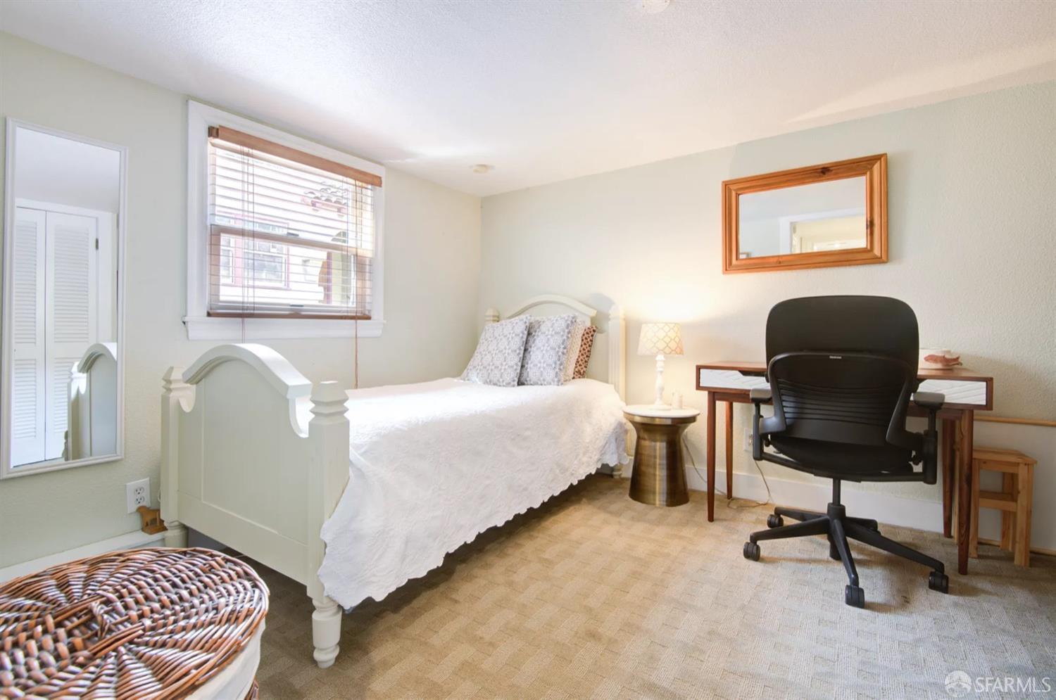 3231 Fernside Boulevard Alameda, CA 94501 - Photo 26 of 38 a bedroom with a bed chair and a window