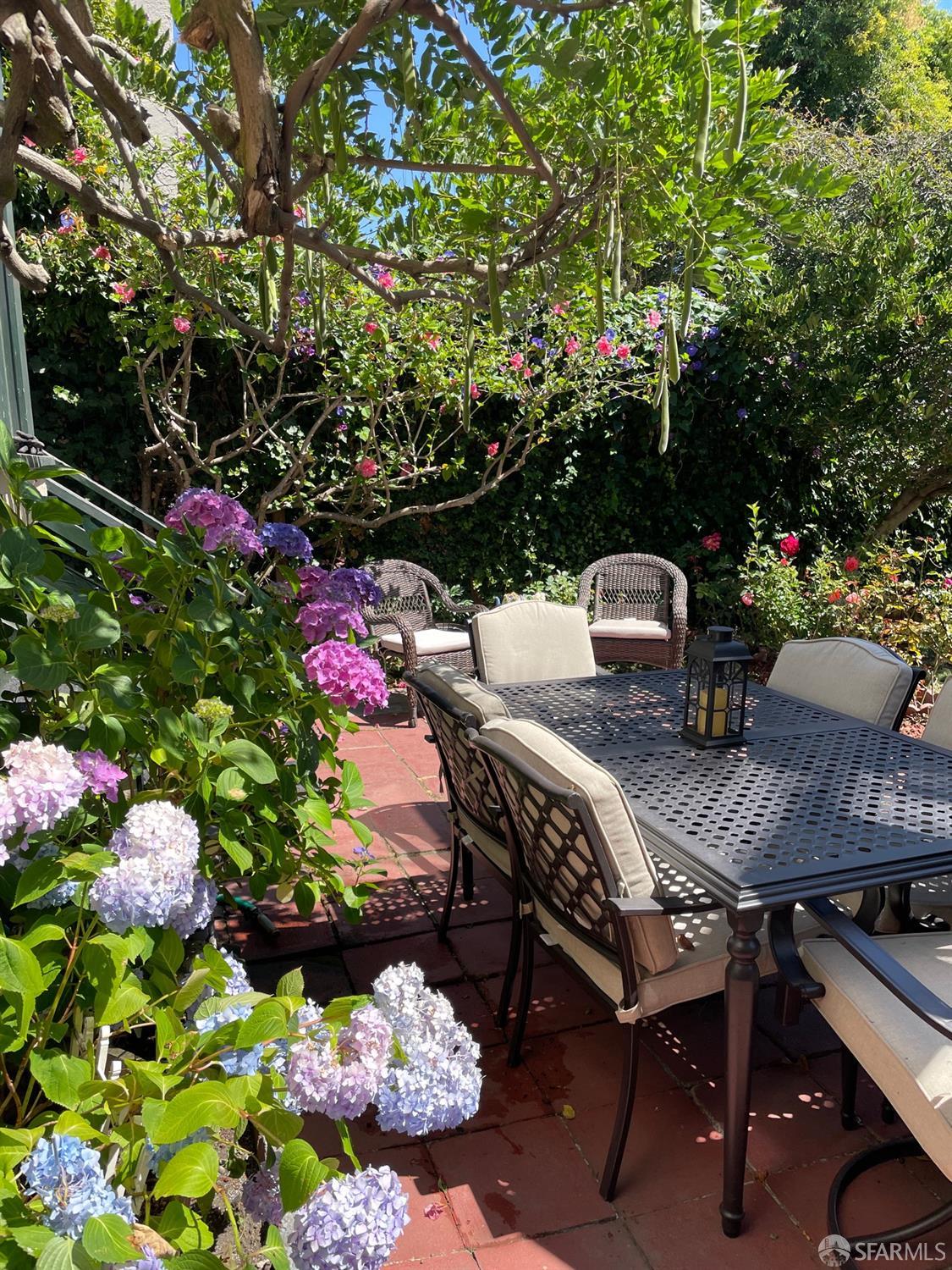 3231 Fernside Boulevard Alameda, CA 94501 - Photo 28 of 38 a outdoor dining space with furniture and flowers