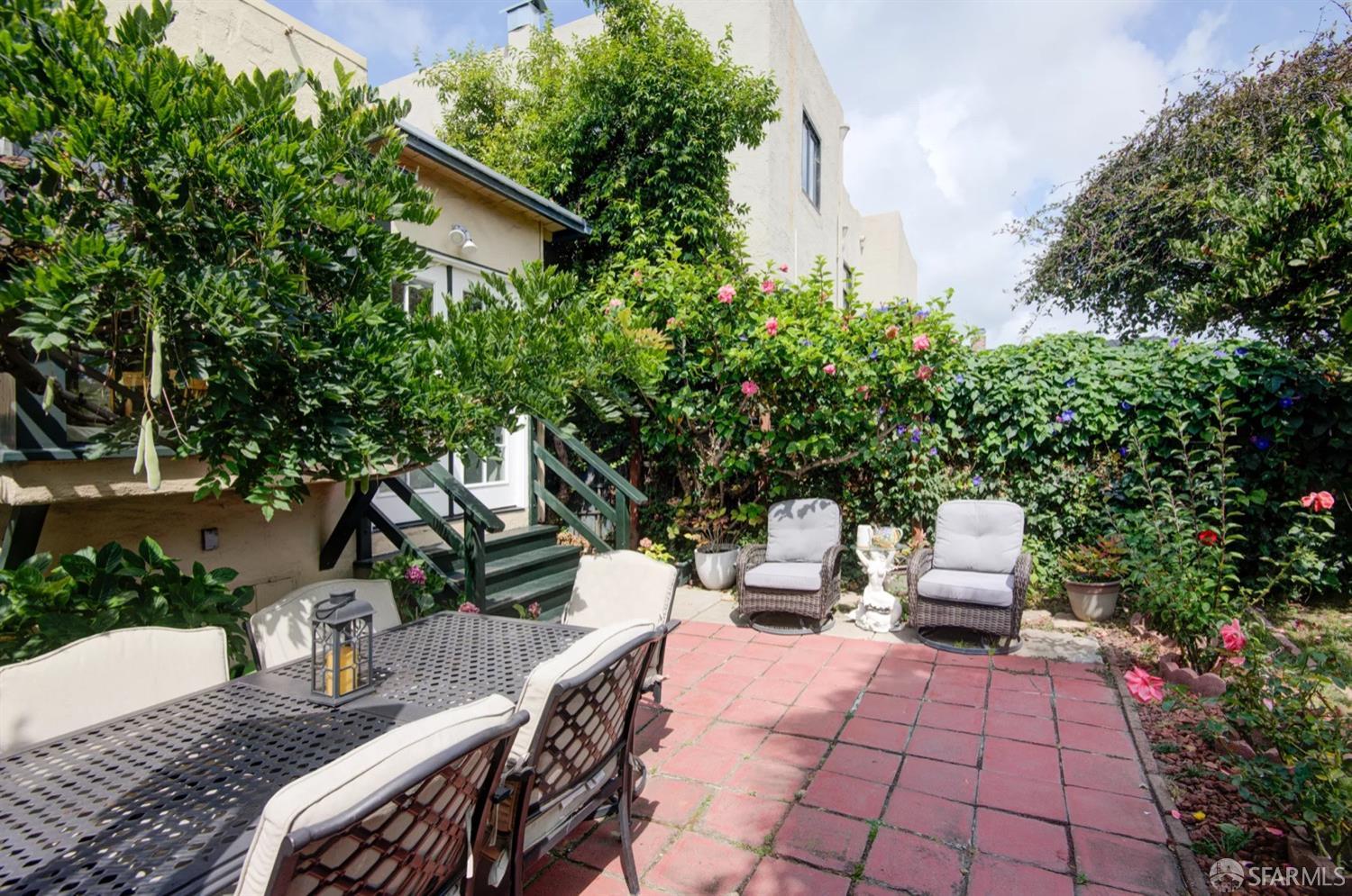 3231 Fernside Boulevard Alameda, CA 94501 - Photo 31 of 38 a view of backyard with outdoor seating and trees