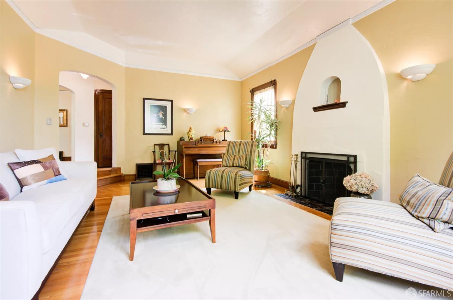 3231 Fernside Boulevard Alameda, CA 94501 - Photo 5 of 38 a living room with furniture and a fireplace