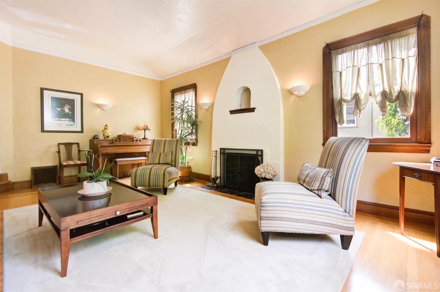 3231 Fernside Boulevard Alameda, CA 94501 - Photo 6 of 38 a living room with furniture and a fireplace