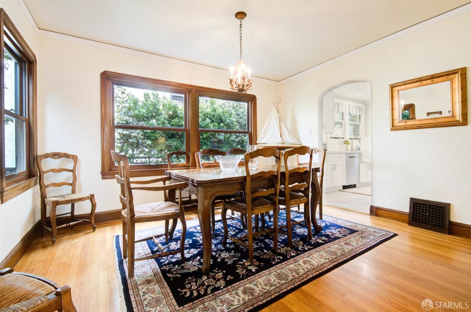 3231 Fernside Boulevard Alameda, CA 94501 - Photo 7 of 38 a view of a dining room with furniture window and wooden floor
