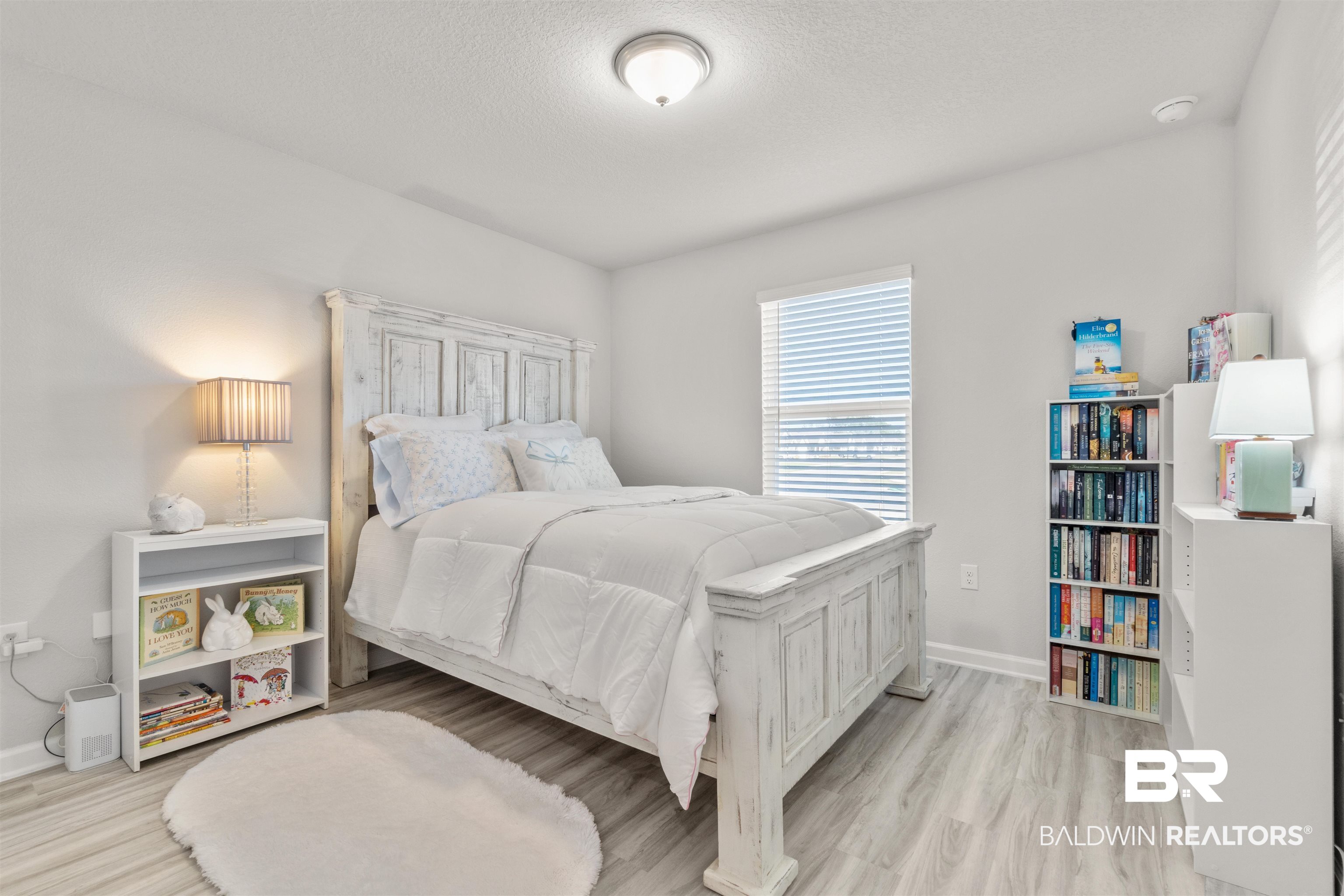 24472 Ringneck Loop Elberta, AL 36530 - Photo 34 of 46 Bedroom featuring light wood-type flooring and a textured ceiling