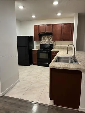 a bathroom with a sink and shower