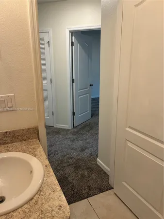 an empty room with an entrance door