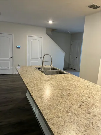 a view of a livingroom with wooden floor