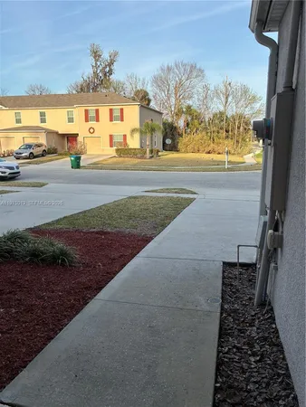 an empty room with wooden floor and closet