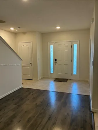an empty room with wooden floor
