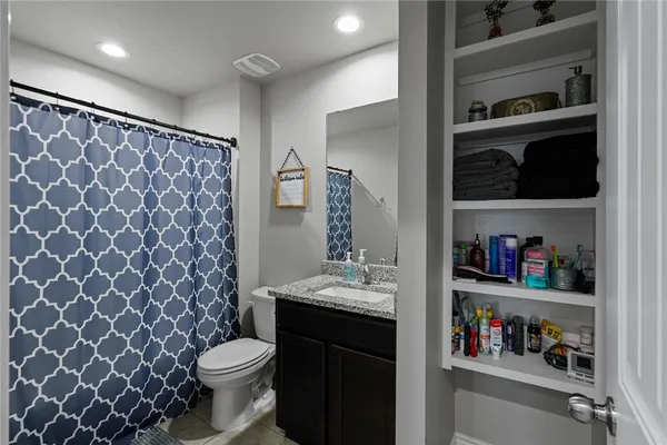 a bathroom with a sink and a toilet