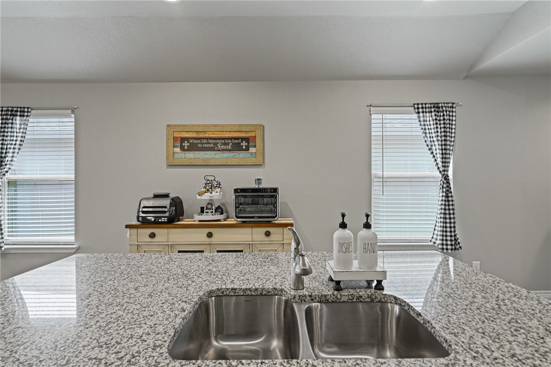 7618 Herd Rider Corpus Christi, TX 78414 - Photo 5 of 14 a kitchen with sink cabinets and window