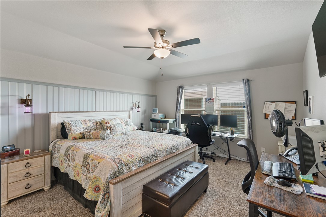 7618 Herd Rider Corpus Christi, TX 78414 - Photo 7 of 14 a bedroom with a bed a desk and chair