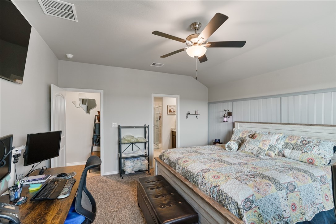 7618 Herd Rider Corpus Christi, TX 78414 - Photo 8 of 14 a bedroom with a large bed and a flat screen tv