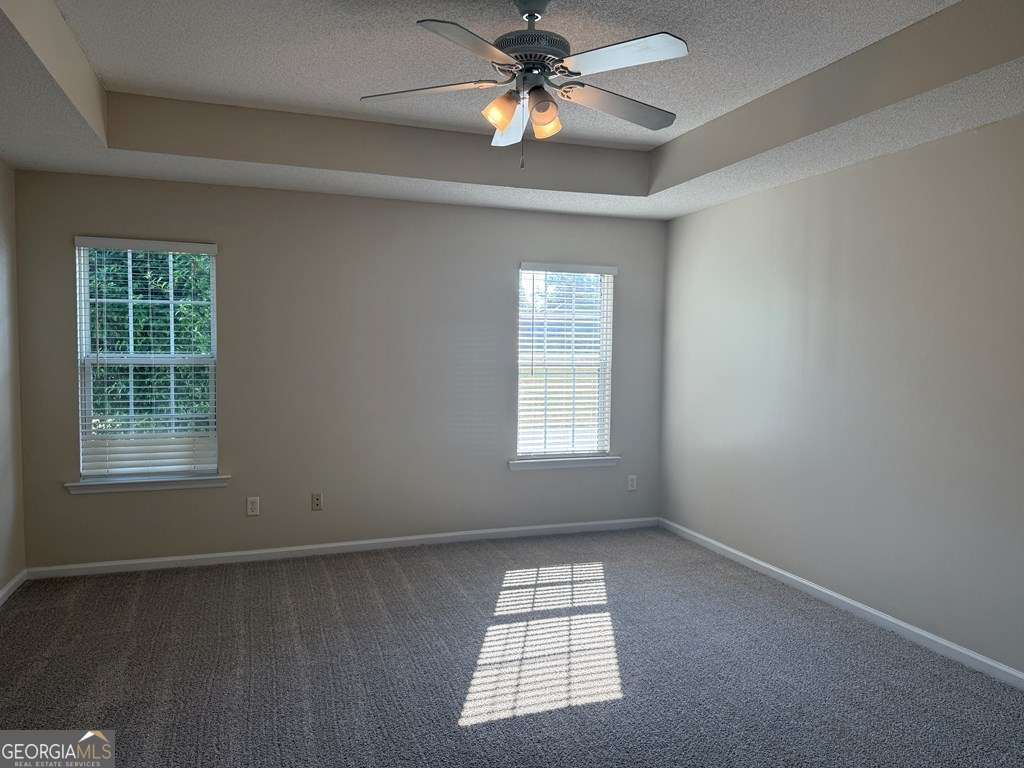 3749 Old Pine Road Valdosta, GA 31605 - Photo 11 of 24 an empty room with windows and fan