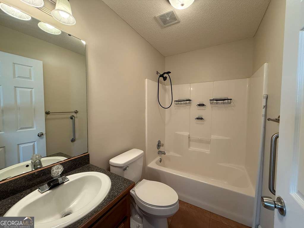 3749 Old Pine Road Valdosta, GA 31605 - Photo 17 of 24 a bathroom with a sink toilet tub and shower