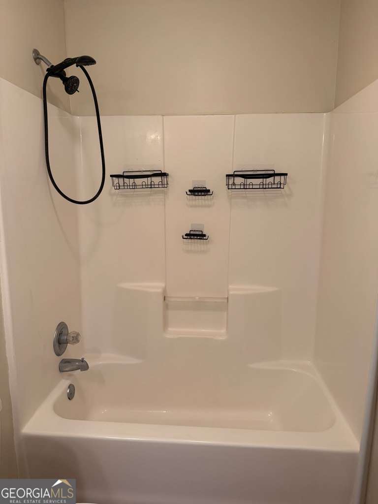 3749 Old Pine Road Valdosta, GA 31605 - Photo 19 of 24 a bathroom with a bath tub and a shower