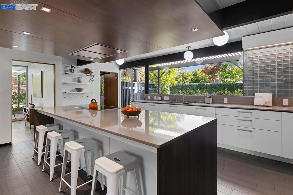 252 Clyde Drive Walnut Creek, CA 94598 - Photo 14 of 57 a kitchen with a sink stainless steel appliances dining table and chairs