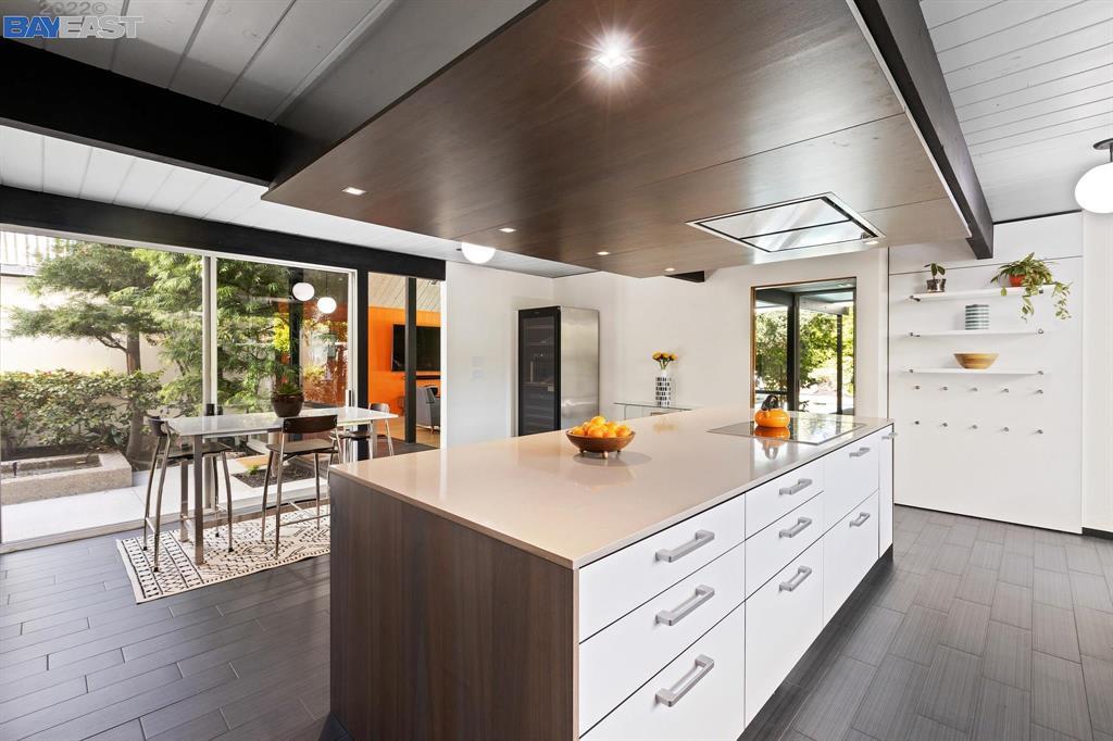252 Clyde Drive Walnut Creek, CA 94598 - Photo 15 of 57 a view of center island with wooden floor and furniture