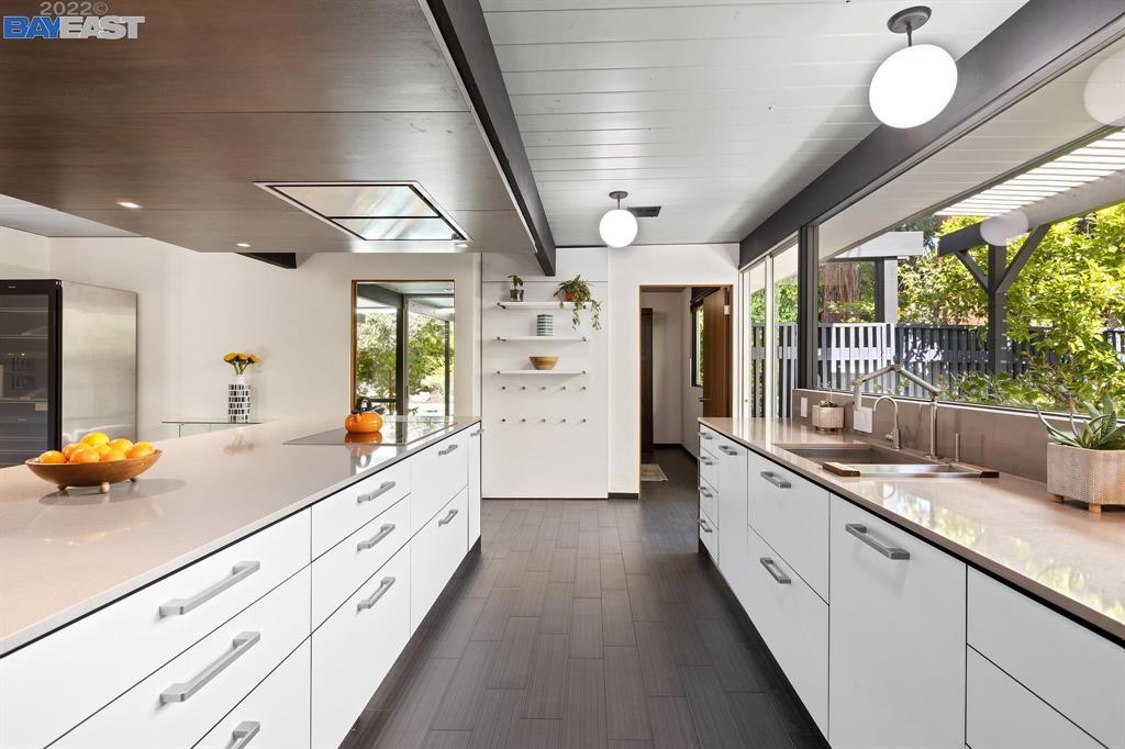 252 Clyde Drive Walnut Creek, CA 94598 - Photo 16 of 57 a large white kitchen with a large window and stainless steel appliances