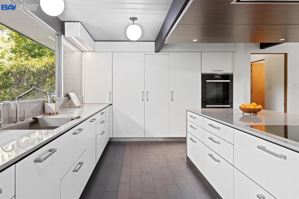 252 Clyde Drive Walnut Creek, CA 94598 - Photo 17 of 57 a large kitchen with granite countertop a sink and dishwasher stove top oven