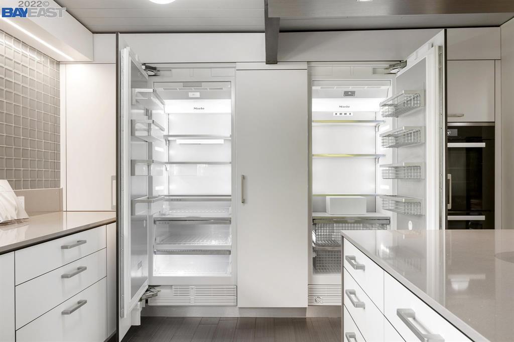 252 Clyde Drive Walnut Creek, CA 94598 - Photo 19 of 57 a kitchen with kitchen island a counter top space and refrigerator