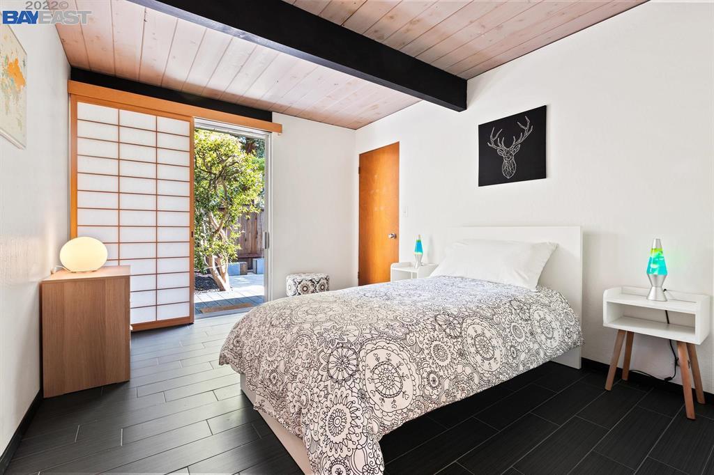 252 Clyde Drive Walnut Creek, CA 94598 - Photo 23 of 57 a bedroom with a bed table and window