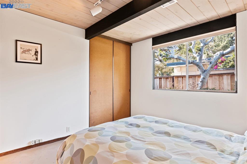 252 Clyde Drive Walnut Creek, CA 94598 - Photo 26 of 57 a bed room with a bed and a large window