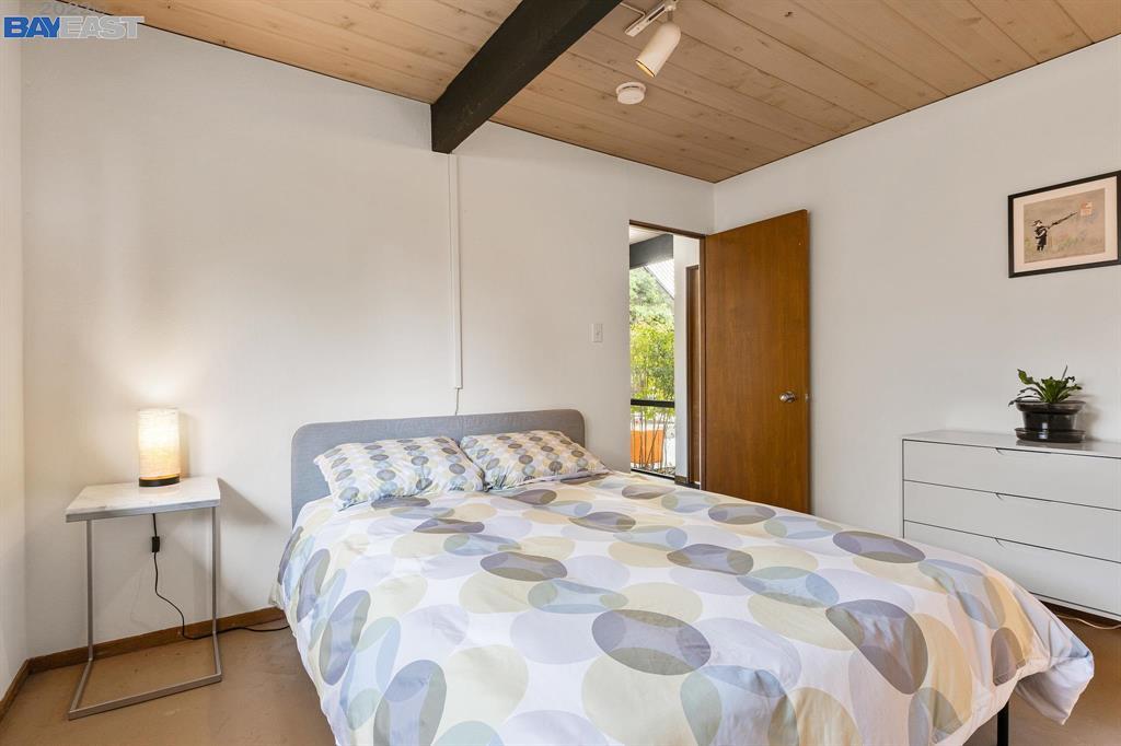 252 Clyde Drive Walnut Creek, CA 94598 - Photo 27 of 57 a bedroom with a bed and a potted plant