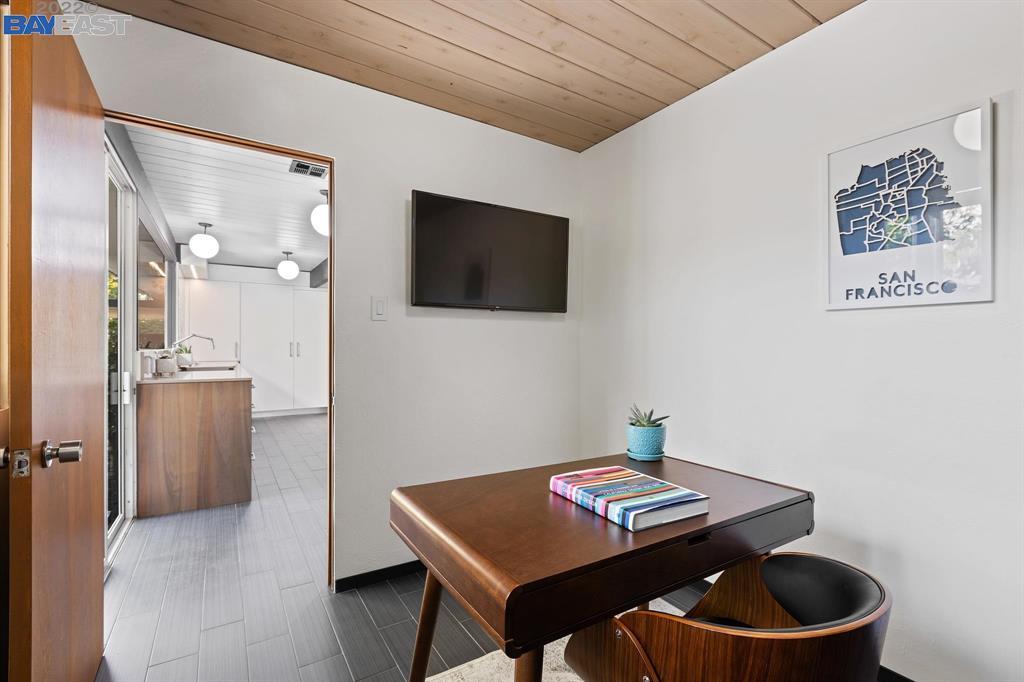 252 Clyde Drive Walnut Creek, CA 94598 - Photo 33 of 57 a living room with furniture and a flat screen tv