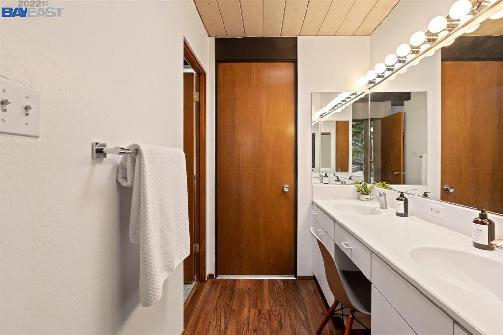 252 Clyde Drive Walnut Creek, CA 94598 - Photo 38 of 57 a bathroom with a sink a mirror and shower