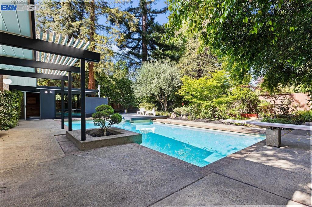 252 Clyde Drive Walnut Creek, CA 94598 - Photo 43 of 57 a view of a patio with couches and table and chairs and potted plants