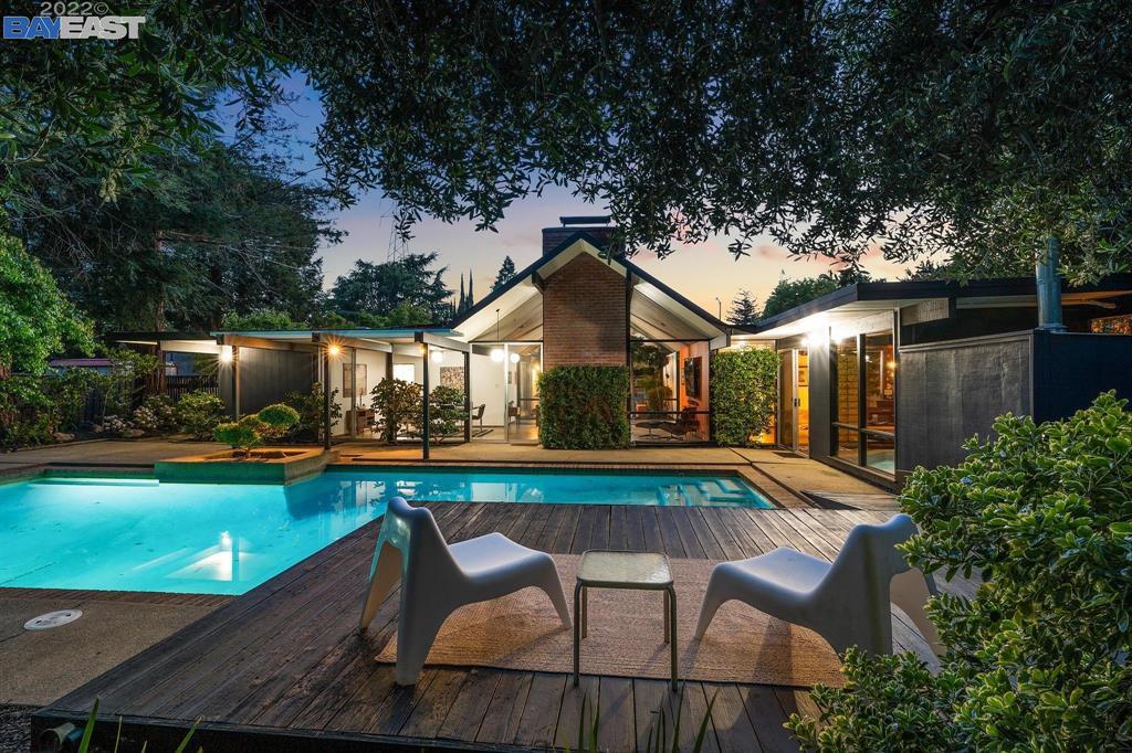 252 Clyde Drive Walnut Creek, CA 94598 - Photo 47 of 57 a balcony with table and chairs potted plants and large tree