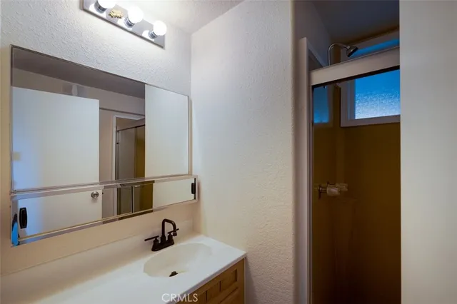 a bathroom with a sink and a mirror