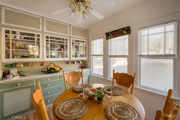 a dining room with furniture and window