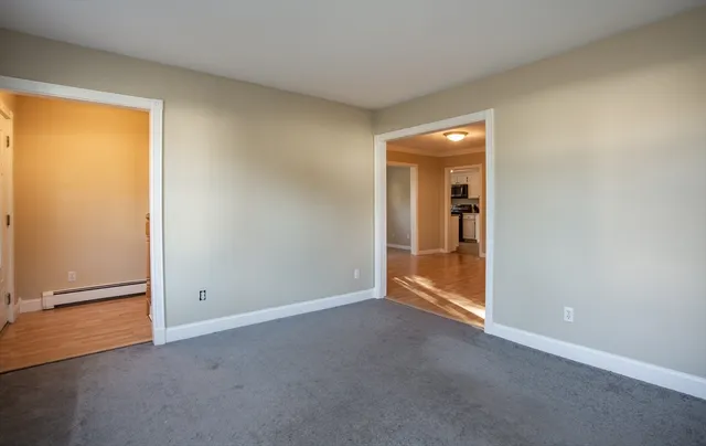 an empty room with closet area