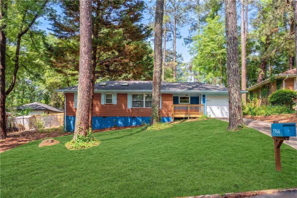 1966 Mark Trail Decatur, GA 30032 - Photo 5 of 25 a front view of house with yard and green space