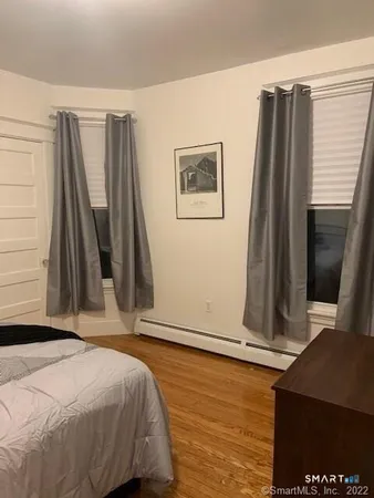 a bed room with a bed and a window