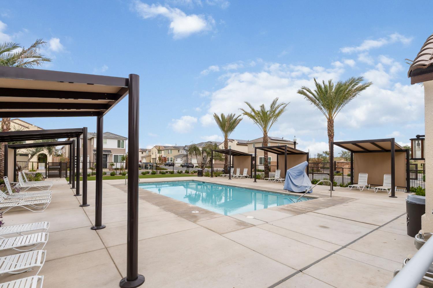 1116 Elevations Way West Madera, CA 93636 - Photo 31 of 35 a view of a swimming pool and lounge chair