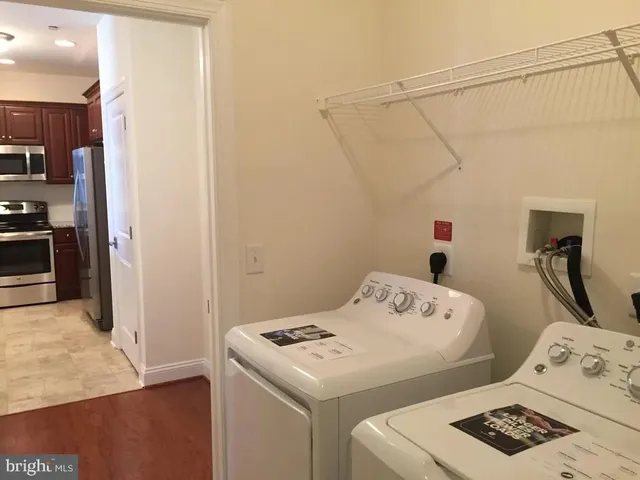 a bedroom with a bed and a table in it