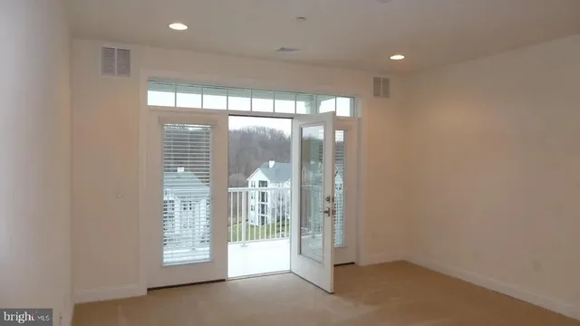 a view of an empty room with a sliding door