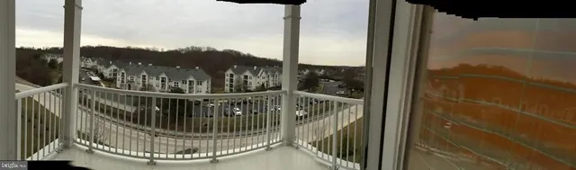 a view of a balcony with a floor to ceiling window