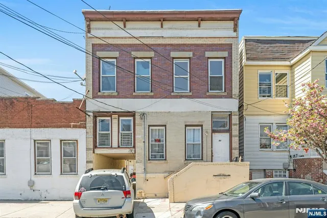 a front view of a house with outdoor space