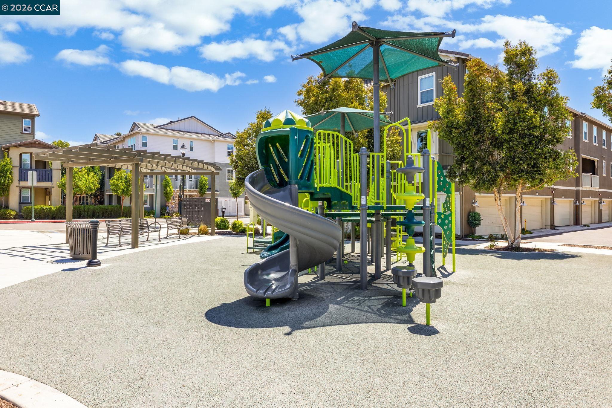 205 Plum Tree Street Livermore, CA 94551 - Photo 46 of 47 a front view of a building with glass top table and chairs