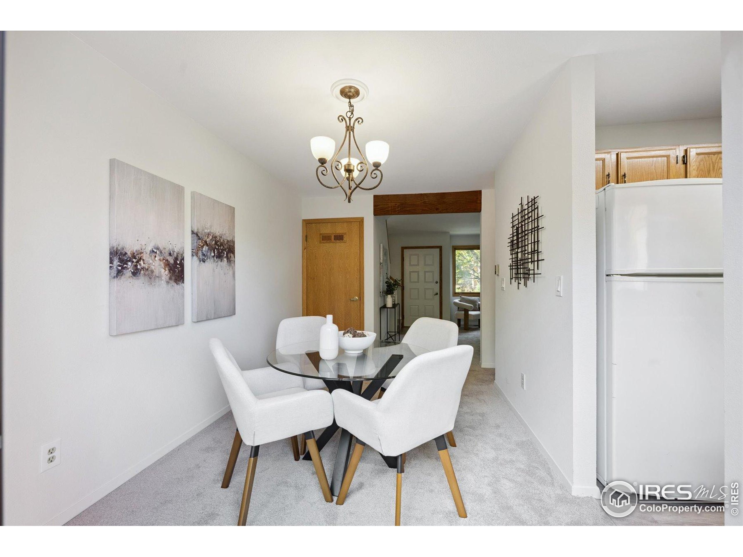 3330 34th Street Boulder, CO 80301 - Photo 11 of 32 a view of a dining room with furniture and a chandelier